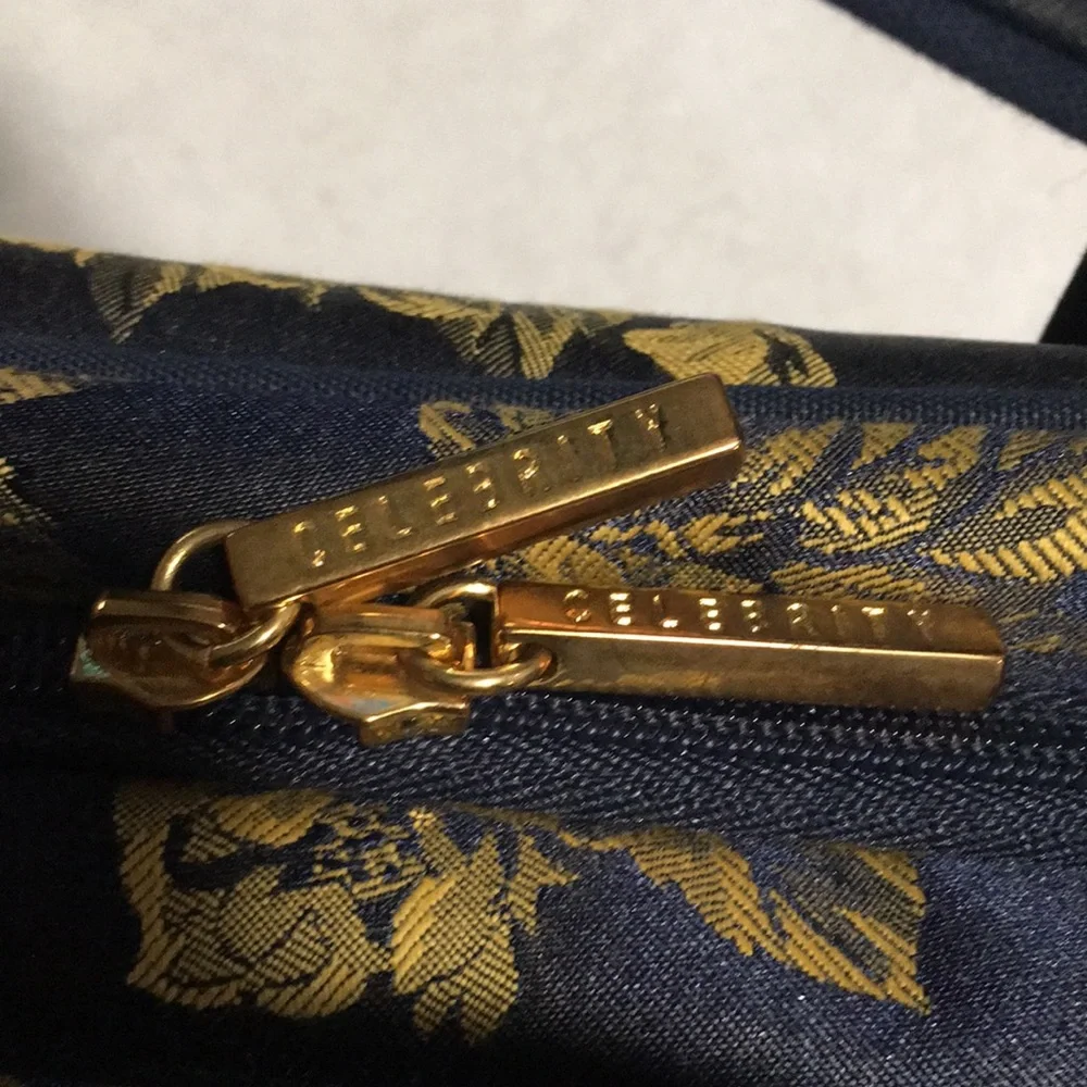 Celebrity travel bag and matching makeup bag. Navy blue with gold flowers